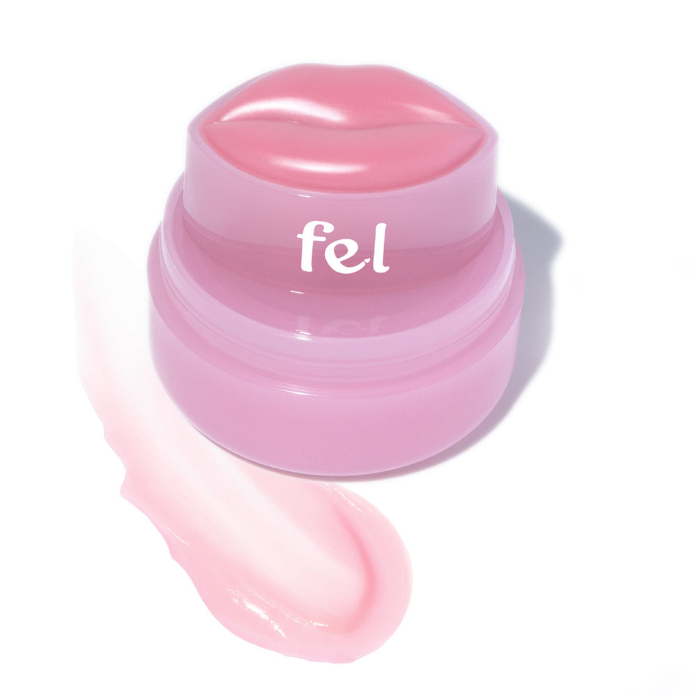 Fel Beauty's Kissylips Lip Balm Product with custom lip-shaped applicator, next to a glossy smear of product. 