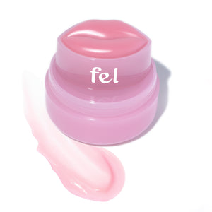 Fel Beauty's Kissylips Lip Balm Product with custom lip-shaped applicator, next to a glossy smear of product. 